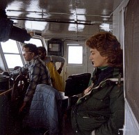 Nancy Friedrich Neff, representing the University of Rhode Island (URI), and Captain Wally Van Horn (Alpine Ocean Seismic Survey, Inc.) with "Alpine" crewman in the wheelhouse of RV Atlantic Twin during cruise AT-84-1.