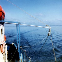 A Benthos 10-element hydrophone streamer deployed to port from the RV UCONN during cruise UCONN 84-1.