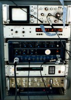 A typical stack of equipment for controlling "boomer-type" seismic-profiling systems and data recorders aboard the RV ASTERIAS.  From top to bottom: electronic technician's monitoring box with built-in oscilloscope, electronic clock, seismic source control box, data recorder control box, and seismic signal pre-amp/filter box.