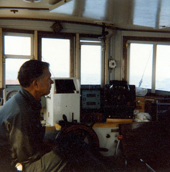 Captain Arthur D. ("Dick") Colburn (WHOI) in his customary position at the helm of the RV Asterias during cruise AST 81-2.