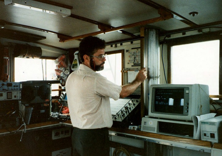 Ralph Lewis (State Geological and Natural History Survey of Connecticut) annotating seismic records on an RV ASTERIAS cruise.