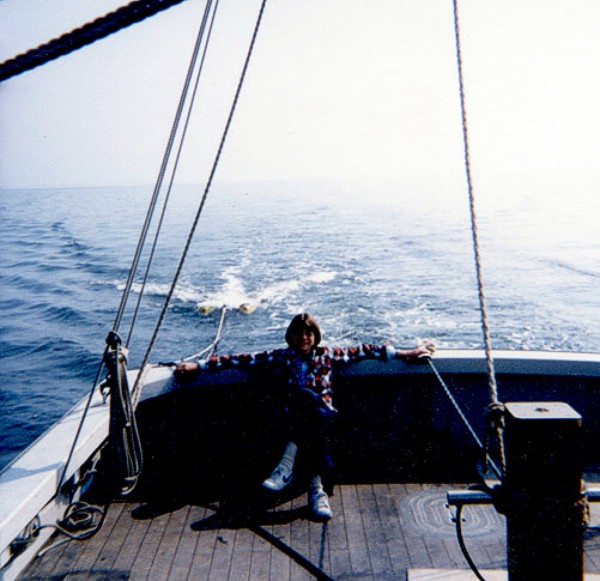 Sally Needell (USGS) fulfilling her "chief scientist" role, with her hands full, during cruise AST 82-3.