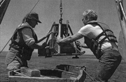 Photograph of Smith-McIntyre (2) Grab Sampler being deployed at sea.