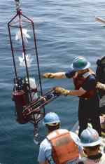 Figure 9. A Vector Measuring Current Meter (VMCM) being deployed as part of a subsurface mooring.   
