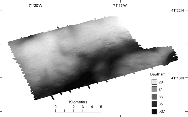 Figure 6. Bathymetric image of study area from sounding and multibeam data. Light tones represent shallower depths and dark tones represent deeper areas. A ridge is located across the northern and western parts of the study area. A channel is located south of the ridge and north and west of a bathymetric high in the southeast. Another bathymetric low is located in the southeastern corner of the study area. 