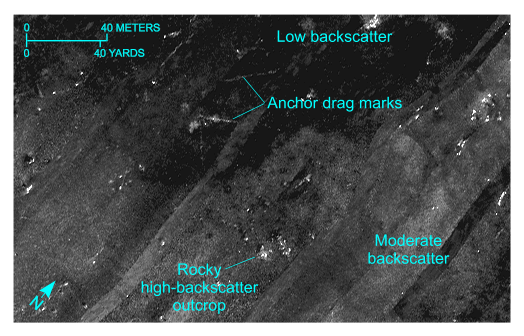 Figure 27. Detailed planar view from the Inner Harbor of the sidescan-sonar mosaic produced during National Oceanic and Atmospheric Administration survey H11077 of Woods Hole, Massachusetts, showing areas of relatively low backscatter and moderate backscatter. Note presence of anchor drag marks and high-backscatter objects interpreted to be rocks. Location of view is shown in figure 19. 