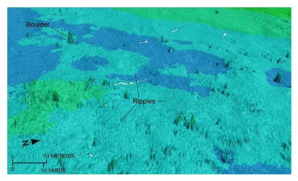Figure 40. Detailed perspective view of the bathymetry in the southeastern part of the study area from the digital terrain model produced during National Oceanic and Atmospheric Administration survey H11077 of Woods Hole, Massachusetts. Note the abundance of boulders and small patches of rippled sand indicative of the exposed glacial drift and the thin, patchy nature of the Holocene deposits in this part of Vineyard Sound. Location of view is shown in figure 19.