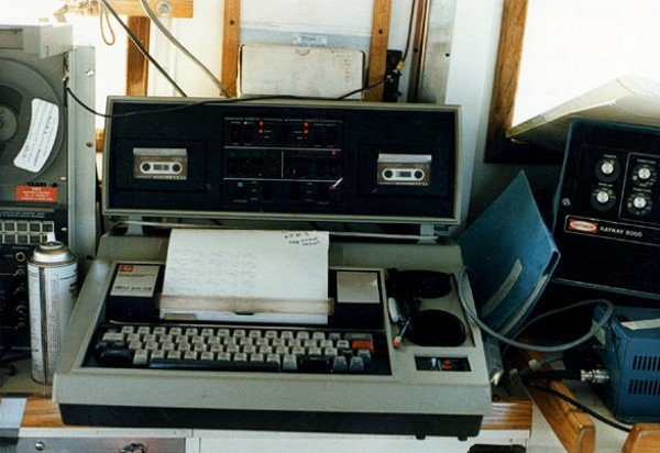 From left to right, aboard the RV ASTERIAS: reel-to-reel, 8-track tape recorder for recording seismic data; "Silent 700" recorder and hard-copy printer terminal for navigation data; USGS cruise operations manual (blue folder); Loran-C display box; and (lower right) manual trigger for marking records.  