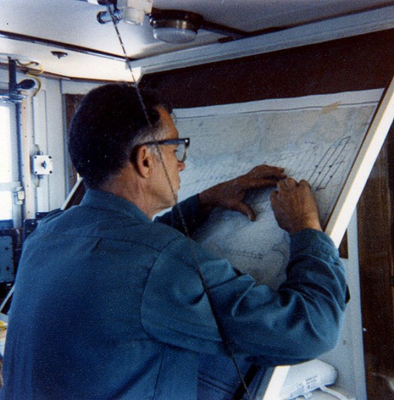 Captain Colburn plotting a course during the early stages of cruise AST 82-3.