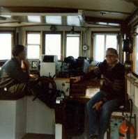 Captain Colburn (WHOI) with Frank Jennings (USGS) in the wheelhouse of the RV Asterias during cruise AST 81-2.