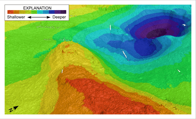 Figure 21. Detailed perspective view of the large depression northeast of Juniper Point from the digital terrain model produced during National Oceanic and Atmospheric Administration survey H11077 of Woods Hole, Massachusetts. Location of view is shown in figure 19. Shallower areas are warm colors; deeper areas are cooler colors.