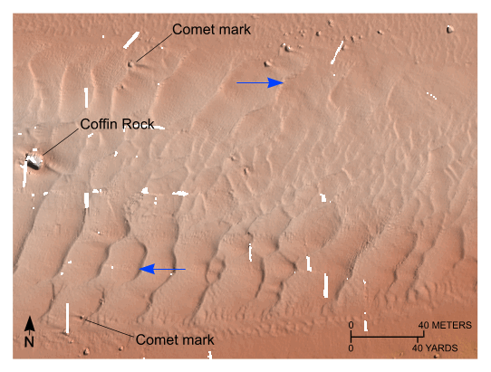 Figure 25. Detailed planar view of the transverse sand waves east of Great Ledge from the digital terrain model produced during National Oceanic and Atmospheric Administration survey H11077. Blue arrows show direction of net transport interpreted from sand-wave asymmetry. Note that scour around boulders forms comet marks and that boulders protrude through the sand and also the sharp transition to megaripples along the northern edge of the field. Location of view is shown in figure 19.